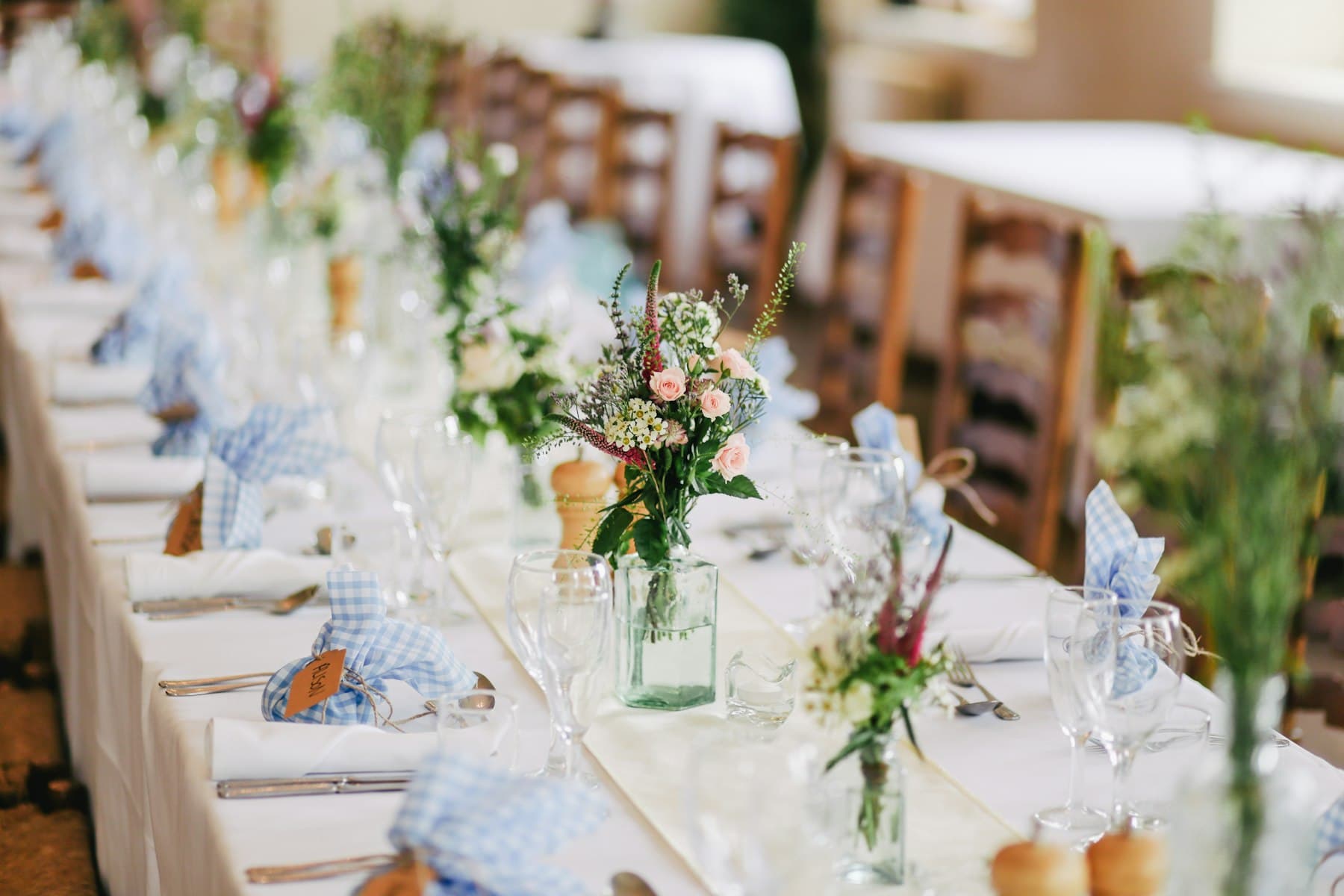 A long wedding table dressed and waiting for guests